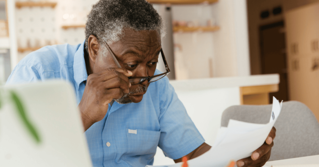 man looking at bill shocked